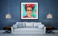 Load image into Gallery viewer, A beautiful and colourful print of Frida Kahlo with red and pink flowers in Frida&#39;s hair against a turquoise and aqua background , in a black frame.
