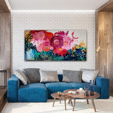 Load image into Gallery viewer, Midnight in the Garden is a large, impressionist style original painting of a mass of hot pink, pale pink and orange blooms on a turquoise, aqua and white background, oil on canvas, light Tasmanian Oak box frame152cm x 76cm. Shown in situ in a living room against a white brick wall.
