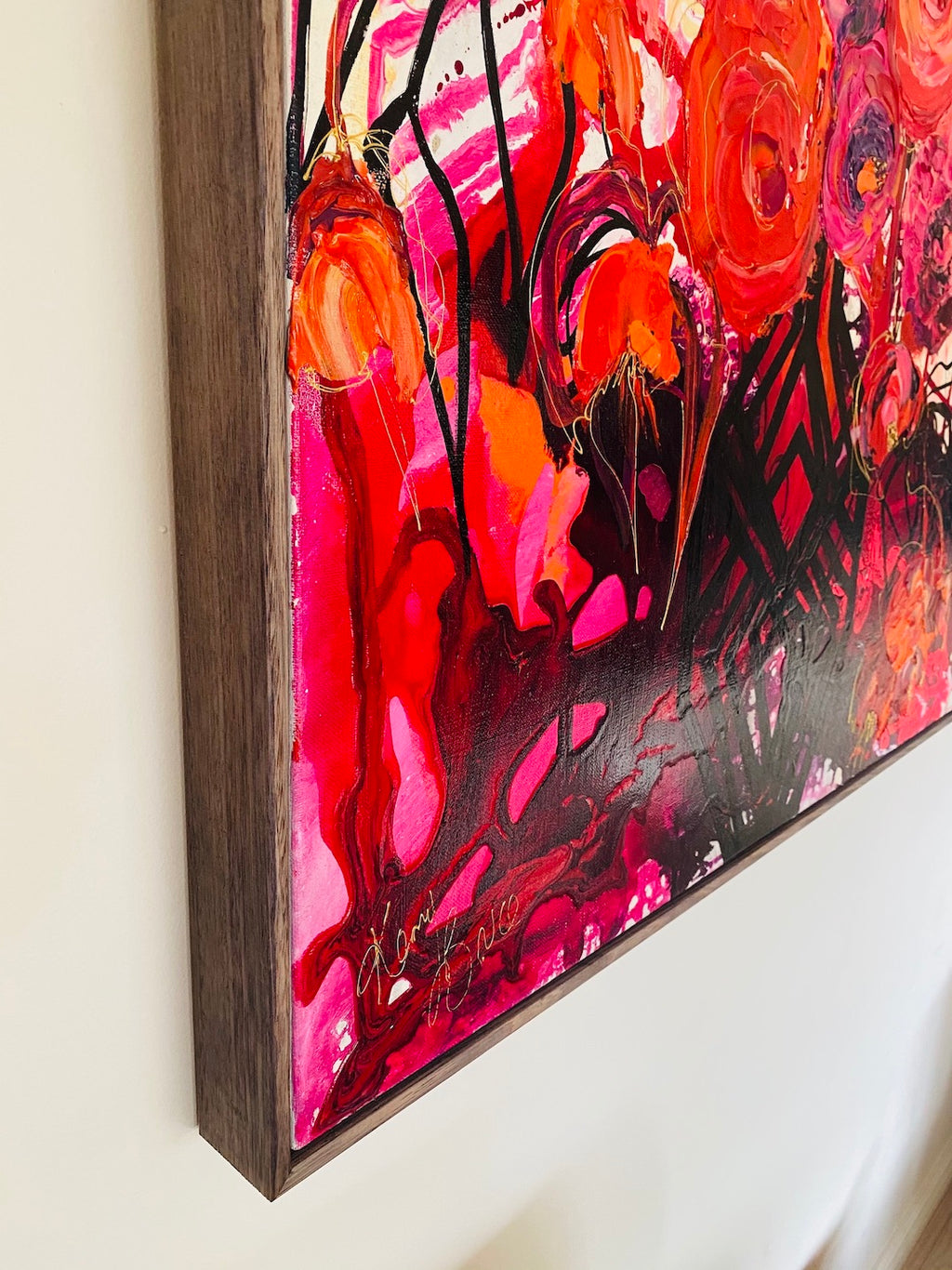 Buds & Blooms is a mass of red, orange and pink flowers in a black lacy vase, 100cm x 100cm Acrylic on Canvas.