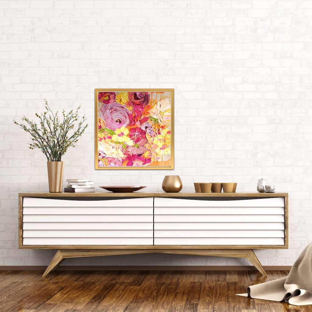 A pretty mass of yellow, pale pink and hot pink coloured blooms, with some leaves in a lovely shade of green framed in Tasmanian Oak against a white brick wall.