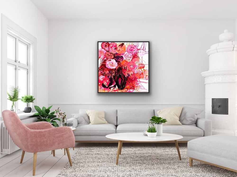 Buds & Blooms is a vibrant mass of red and pink blooms in a black vase with a black frame