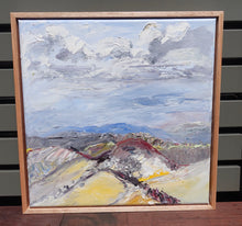 Load image into Gallery viewer, Landscape with lots of yellow countryside and pale grey storm clouds. Framed view.
