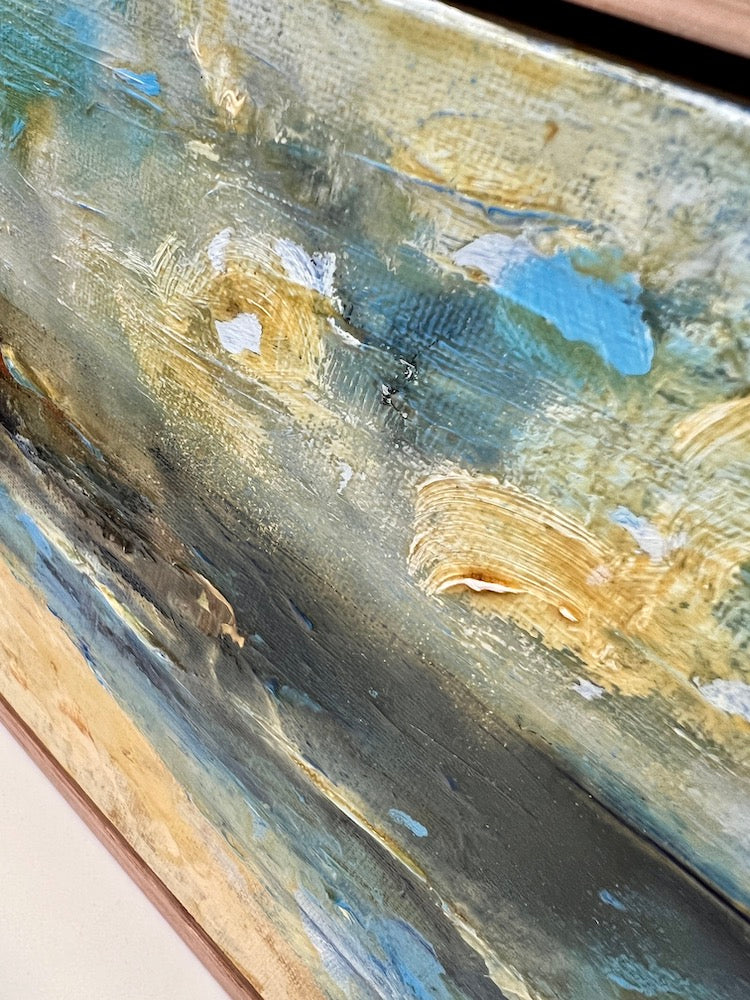 Abstract coastal scene in shades of yellow and blue. Detail view.