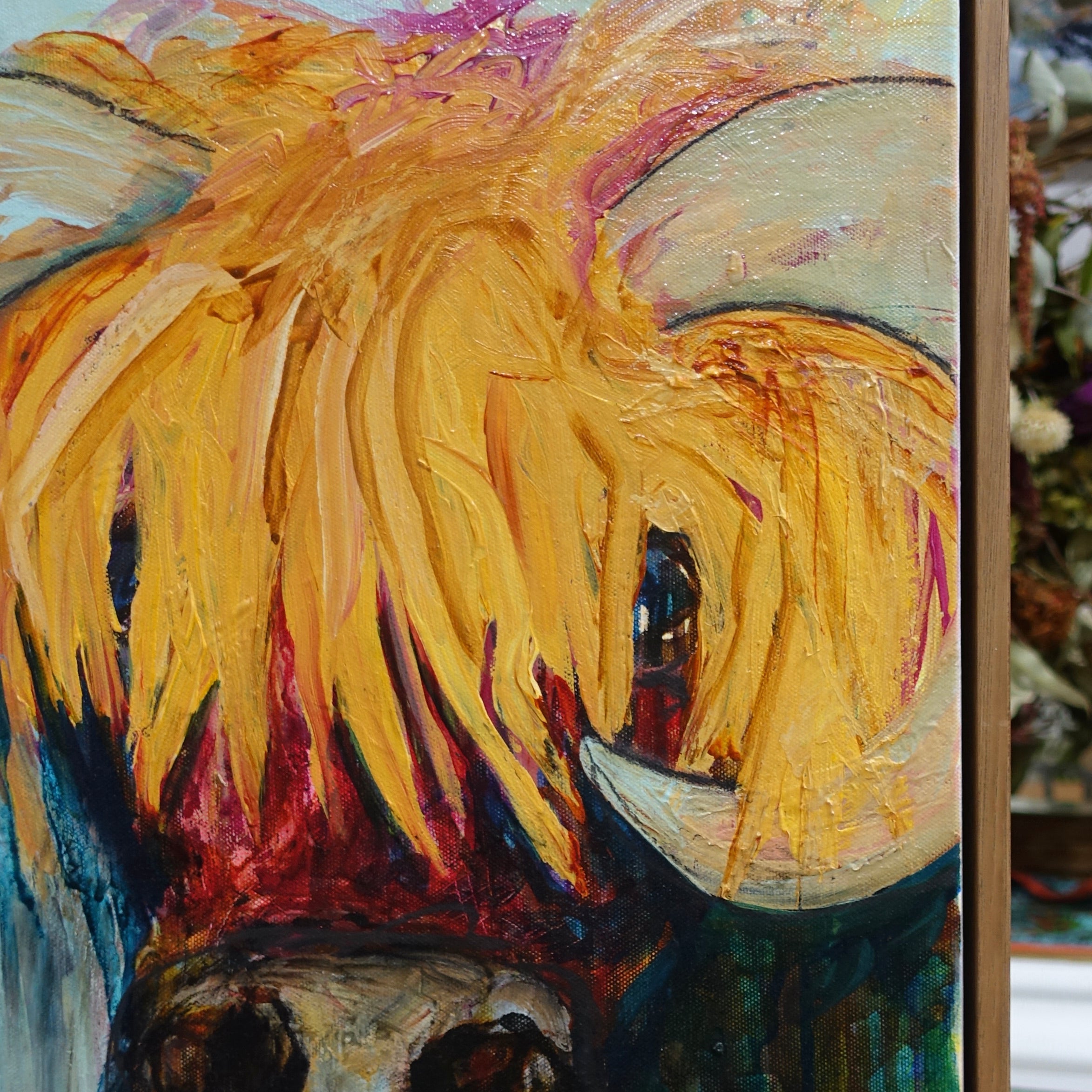 Portion of a painting of Blondie, a gorgeous bovine with long blonde hair.