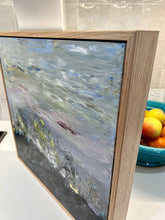 Load image into Gallery viewer, Abstract country landscape with a charcoal colour in the foreground with and yellow wildflowers coming out of rocks, with touches of aqua and a muted multicoloured background. Side view.
