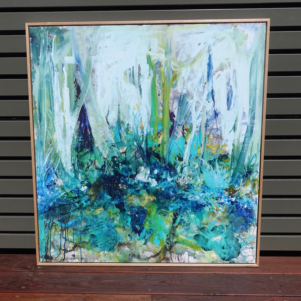 Abstract painting of a forest in lovely shades of turquoise and aqua. Framed view.