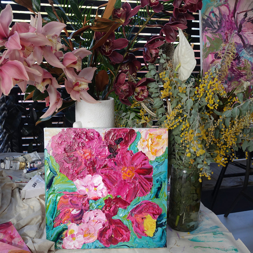 Peony Coast is an original painting of a bunch of hot pink and pale pink blooms on a turquoise background by artist Kerry Bruce, acrylic on canvas, 39cm x 39cm.