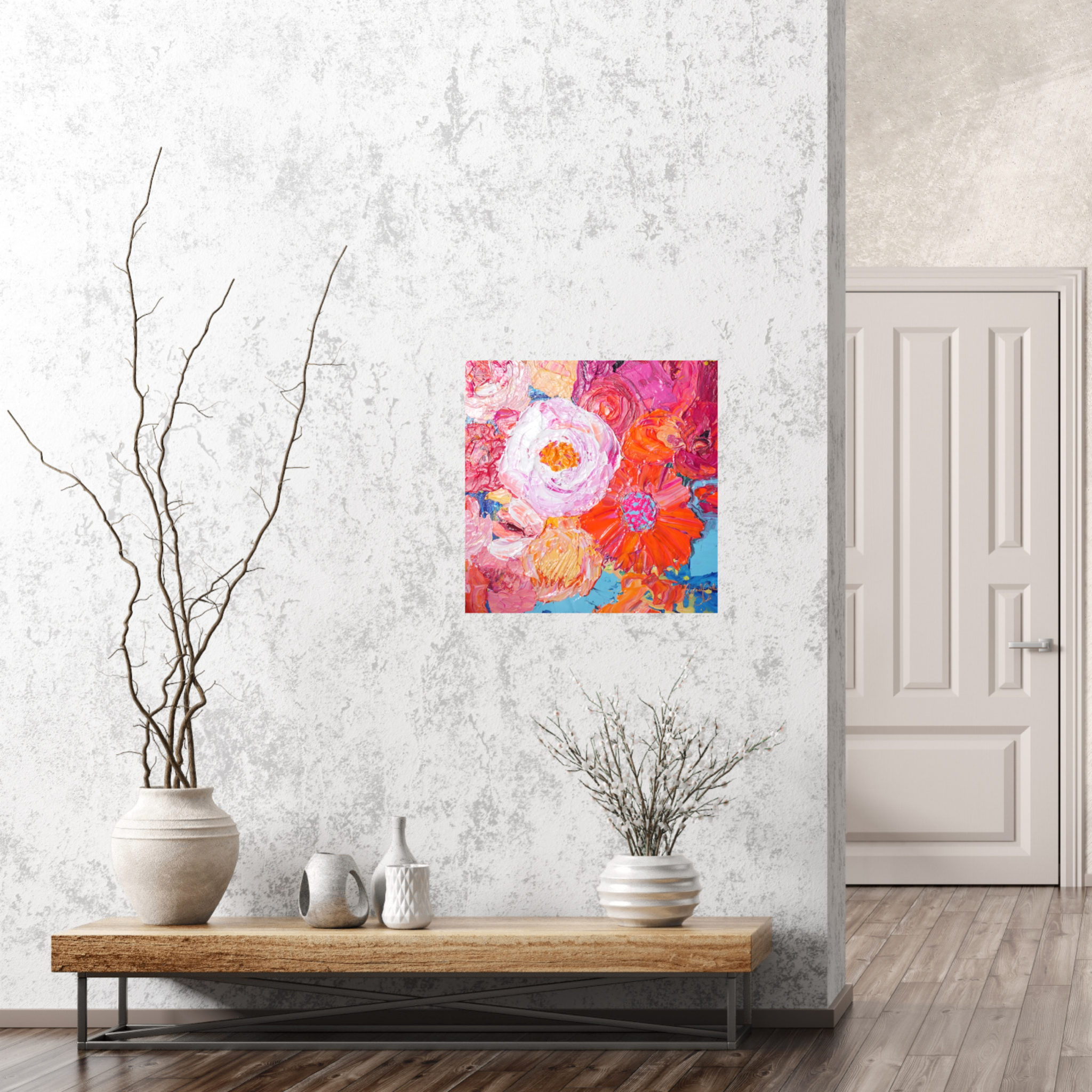 Petal is an original painting of a mass of pale pink, hot pink, orange and soft yellow flowers on a light blue background. Acrylic on canvas, 39cm x 39cm. Shown in situ against a marbled white wall.
