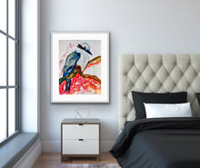 Load image into Gallery viewer, Kelsey Kookaburra is an original painting of a kookaburra, acrylic on 500gsm archival art paper, framed in white timber. Shown in situ in a bedroom against a pale grey wall.
