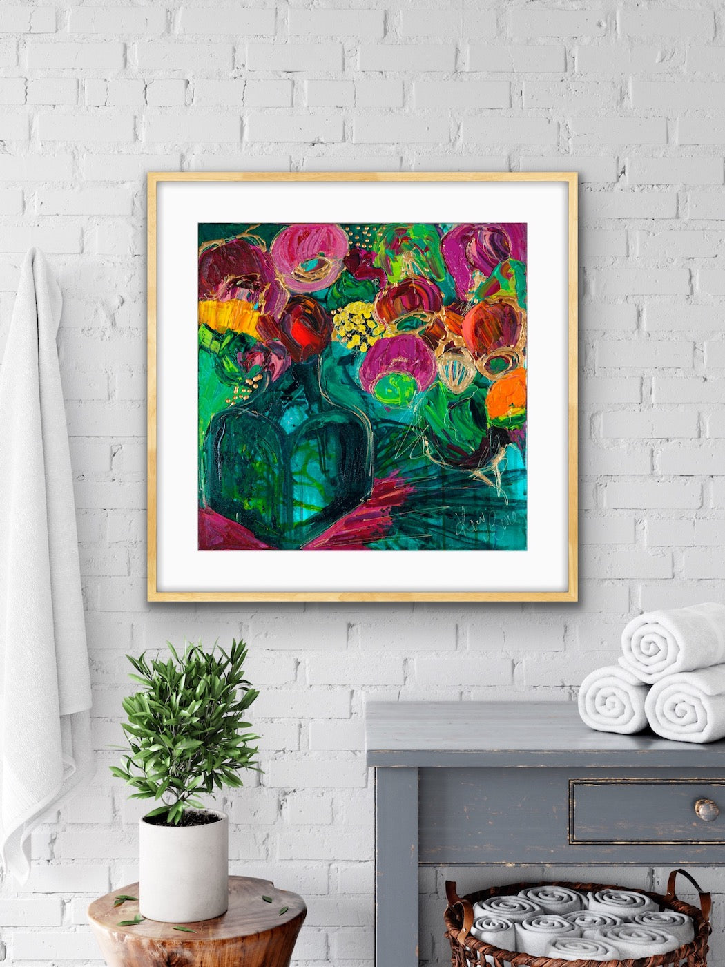 A magnificent bunch of vibrant blooms in a turquoise glass vase against a turquoise, green and magenta background, framed in Tasmanian Oak.
