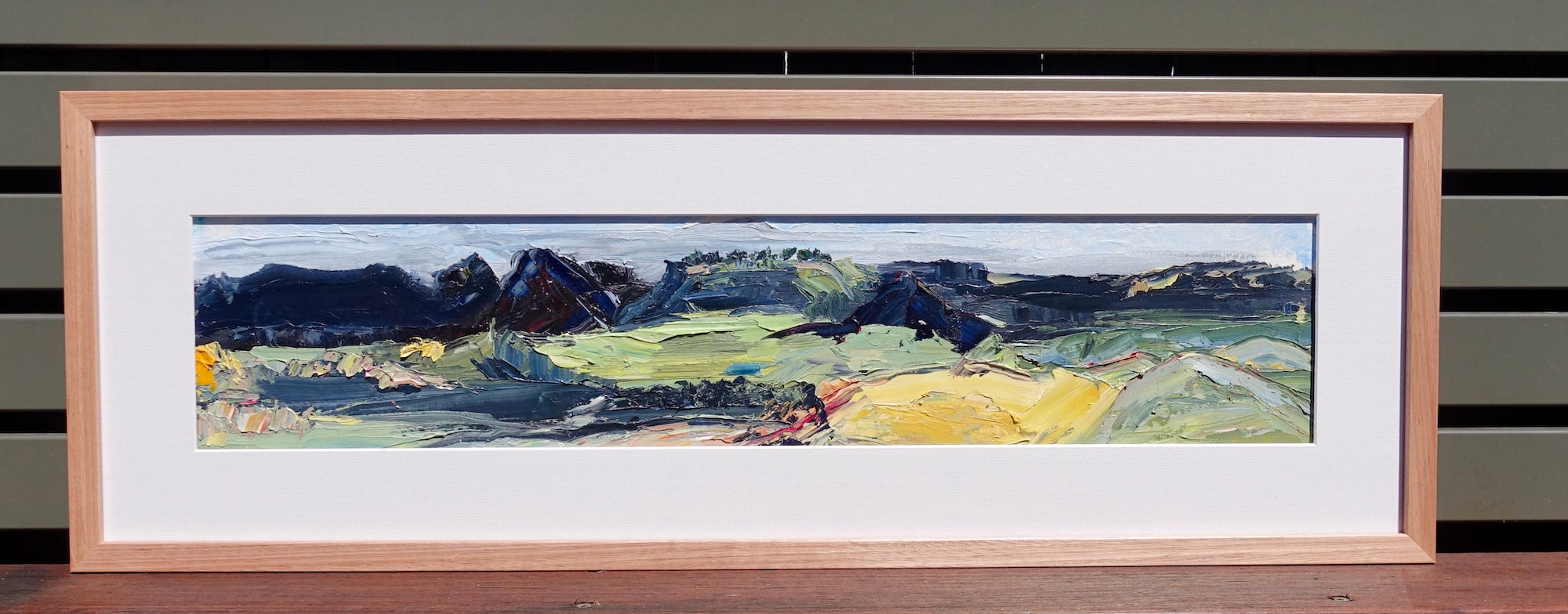 Hills and countryside around Kandos in country NSW, painted in an abstract style. Framed view.