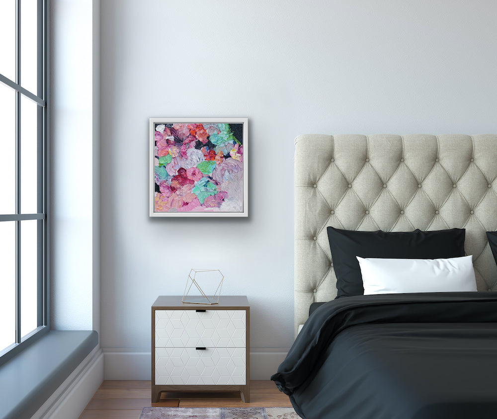 Original painting of a bouquet of pastel coloured blooms, just like a lollipop, shown on a bedroom wall.