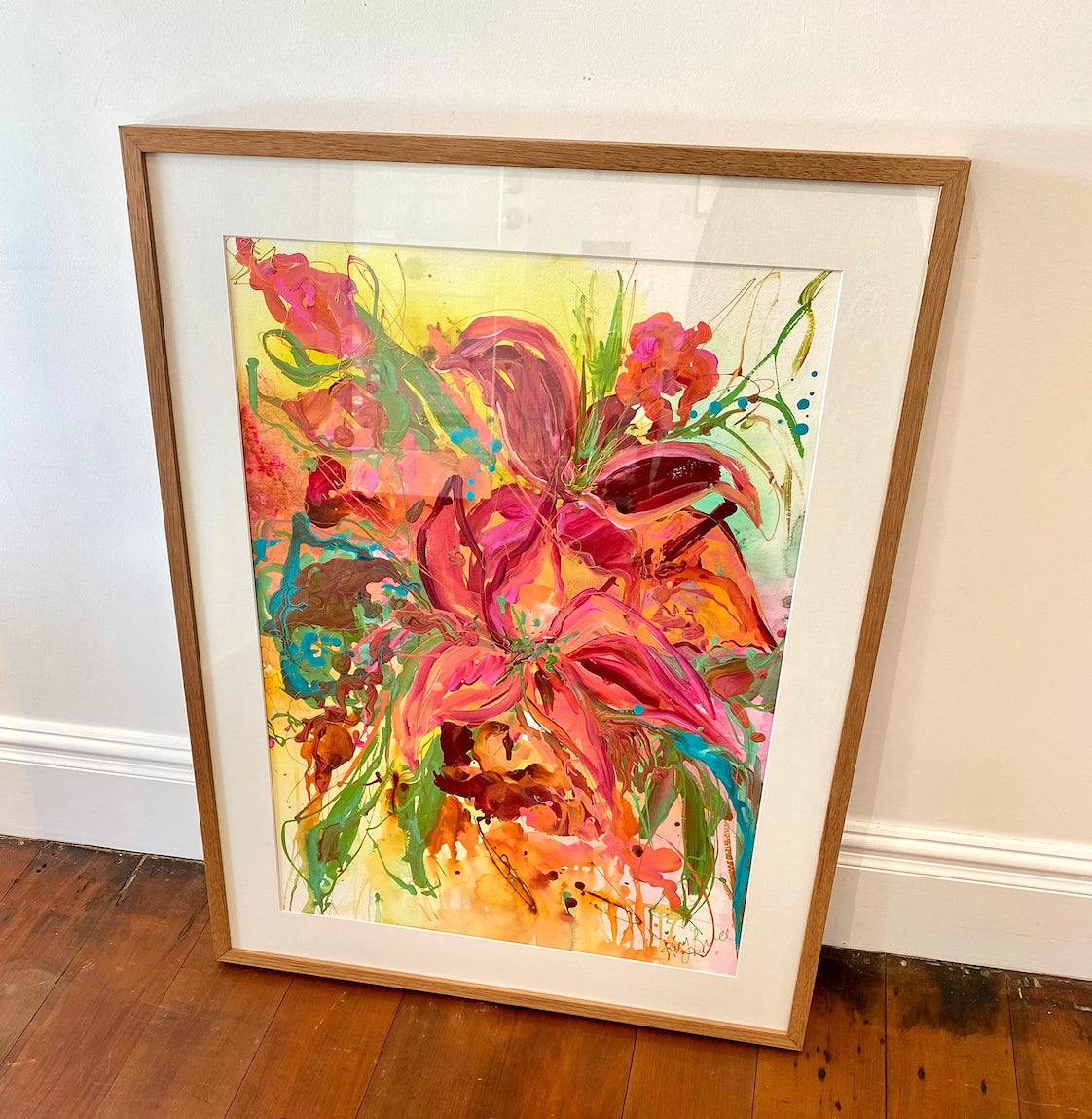 Framed  original artwork on paper by Kerry Bruce of a large vibrant bunch of colourful blooms in shades of pink, aqua, green and yellow.