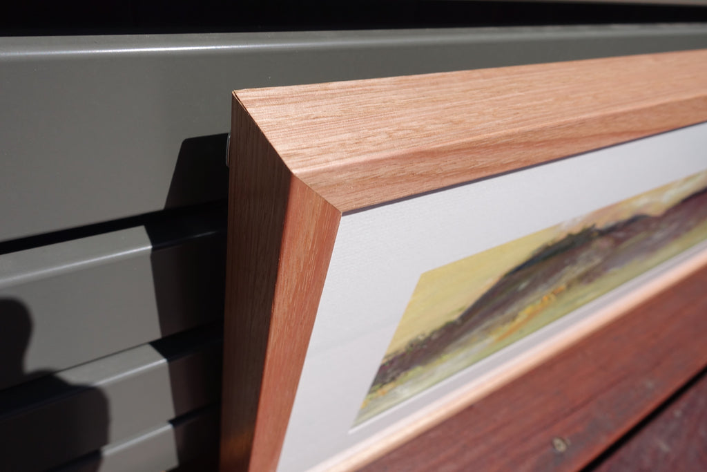 Hills and grassy countryside of Sofala NSW, painted in an abstract style. Close-up of frame.