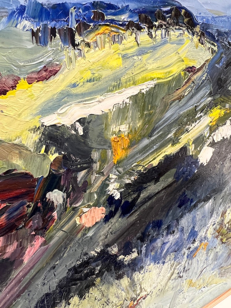 Abstract landscape with flashes of yellow in the countryside and blue mountains and blue sky. Detail view.
