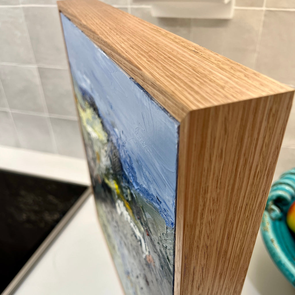 Abstract landscape with flashes of yellow in the countryside and blue mountains and blue sky. Side view.