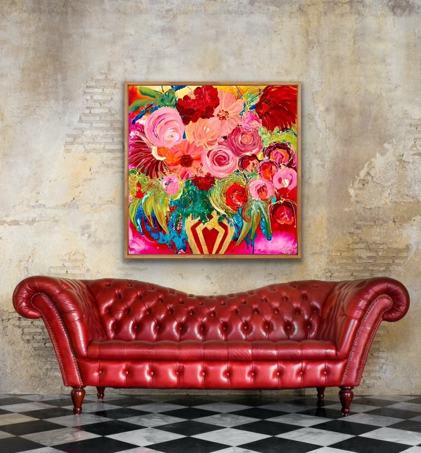 A stunningly beautiful print of a mass of blooms in shades of pink, red outlined in gold, in a gold vase against a hot pink background. Framed in Tasmanian Oak.