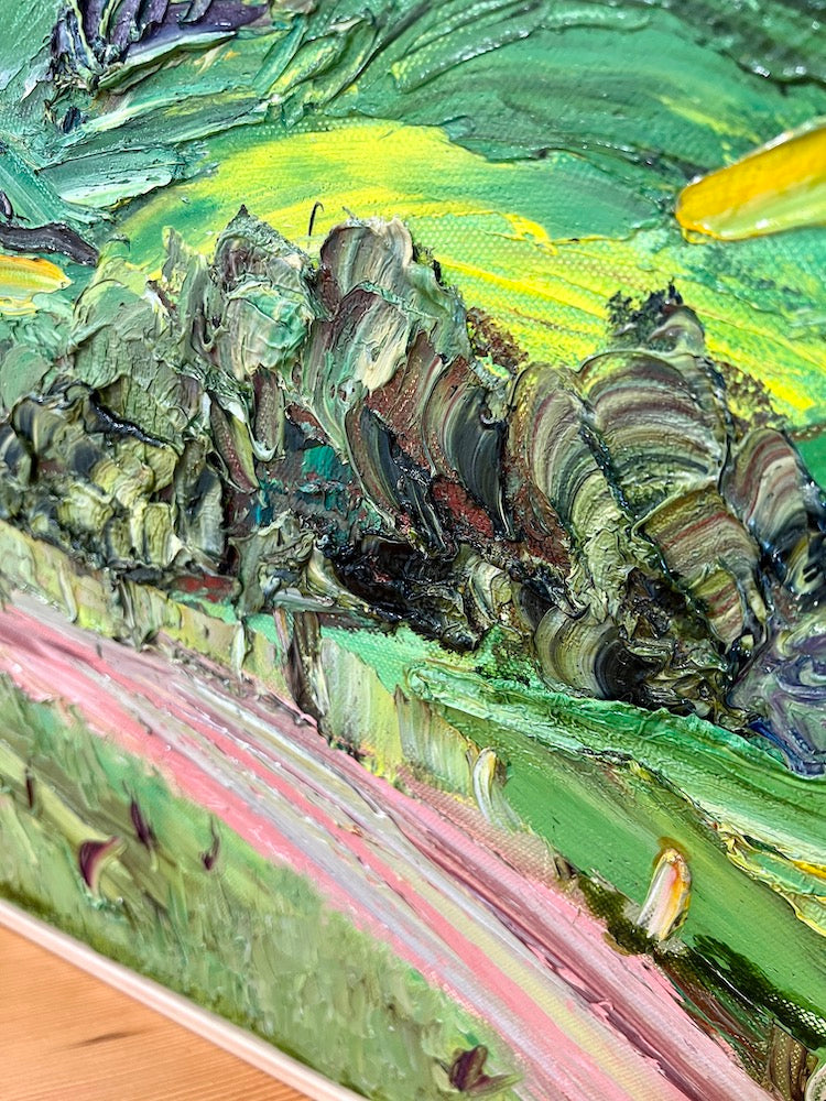 Abstract landscape of rolling green and yellow hills and a winding pink road. Detail view 2.