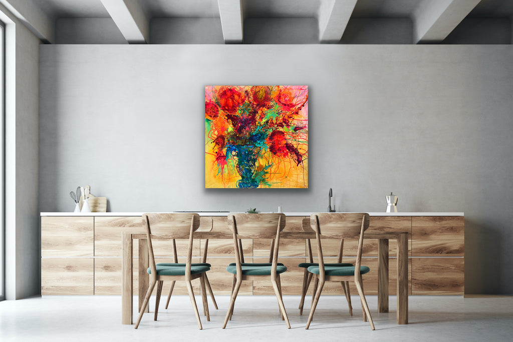 Original painting of a blue vase filled with coral blooms on a yellow background. Acrylic on canvas, framed in an oak box frame., shown in situ in a dining room