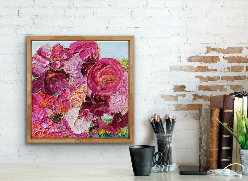 Original painting of a gorgeous bunch of florals in all shades of pink, entwined with gold thread on a pale blue background, in a Tasmanian Oak frame.